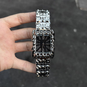 Silver baroque watch with a rectangular red dial and Roman numerals