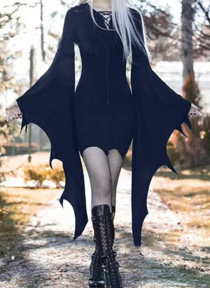 Navy blue goth mini dress with long bat wing sleeves, worn with fishnet tights and lace-up boots
