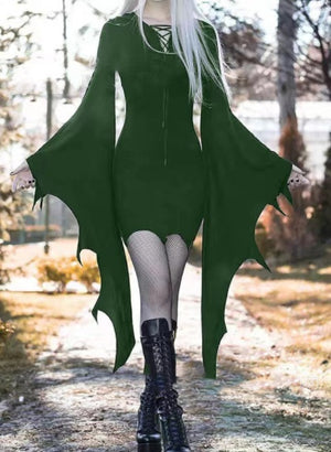 Dark green elf style mini dress with bat wing sleeves and lace-up neckline, front view in a park