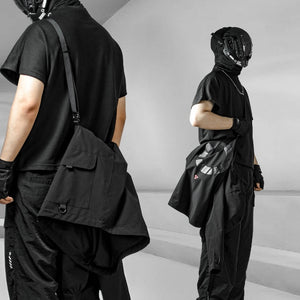 Black Hooded Techwear Windbreaker folded and slung across the body on its strap, worn like a shoulder bag