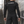 Back view of the black long sleeve compression shirt in a tiled stairwell, white CYBER logo on the upper back