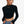 Black Long Sleeve Crop Top, front view with hands in the pockets of blue jeans and a chain necklace, mock neck