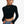 Black long sleeve crop top, front view of the mock neck and the curved cropped hem above high-waisted blue jeans