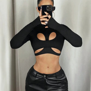 Black Y2K Cut Out Top, front view on a model with teardrop cut outs above the bust and a cut out band below