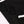 Close-up of the black cotton fabric and the white piped seam on the crop top, shown folded flat