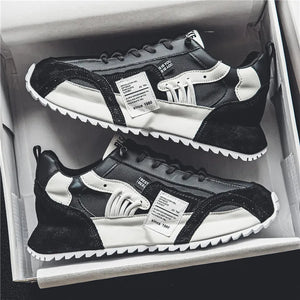 Breathable mesh techwear sneakers worn with slim trousers, styling shot