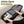 Black business backpack with a structured shell body and side water bottle pocket