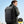 Black business backpack with a structured shell body and side water bottle pocket