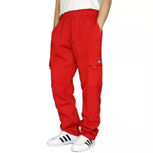 Red straight leg gym sweatpants with an elastic drawstring waist and flap thigh pocket, front view