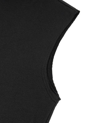 Close-up of the raw armhole edge, cut wide and left with a soft unfinished line down the side