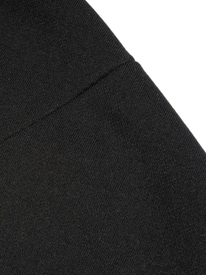 Close-up of the shoulder seam, showing the heavy knit and the single line of flat stitching