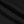 Folds of the black cotton laid across each other, showing the weight and matte surface of the knit