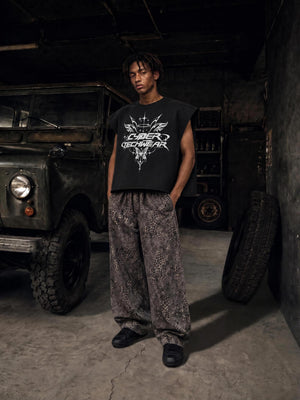 The model stands facing the camera, the boxy cut sitting short and square above the waistband