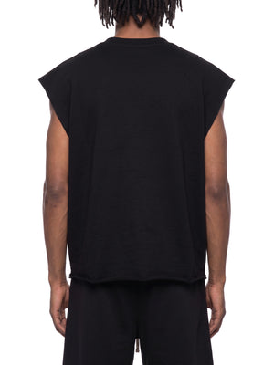 Studio back view on the model in black, the hem finishing square across the lower back