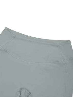 Close-up of the haze blue front waistband, wide and flat, stitched along its lower edge