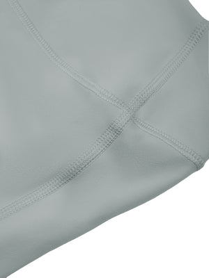 Close-up of a seam on the haze blue knit, flat stitching joining the panels at the crotch