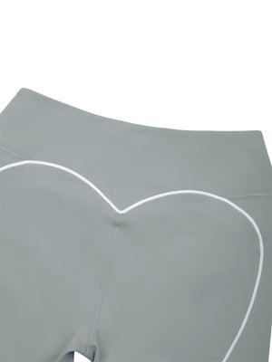 Close-up of the back, the white trim dipping into the centre of the heart below the waistband