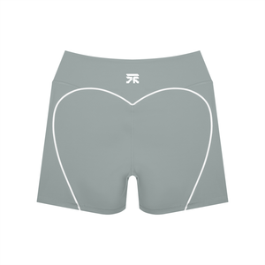 Back of the haze blue booty shorts laid flat, white heart-shaped trim and a small logo on the band
