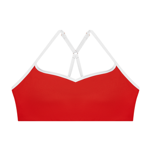 Red colourway laid flat from the front, the bright red body framed by the white contrast trim