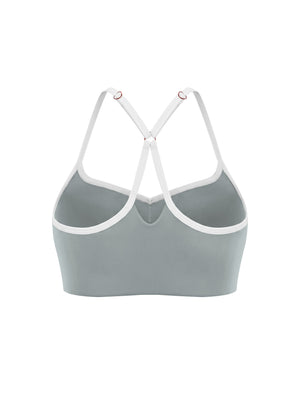 Haze blue sports bra from the back at an angle, the straps crossing into the Y with their sliders