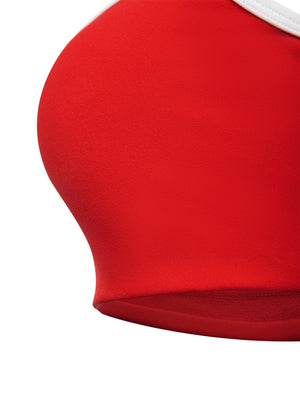 Close-up of a red cup from the side, the smooth nylon knit curving under the white trim