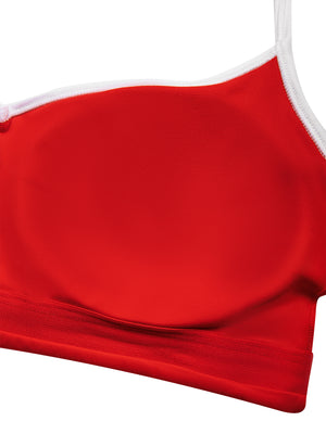Inside the red sports bra, a cup pad set into the lining above the wide elastic band