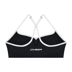 Back of the black sports bra laid flat, Y straps over the band with CYBER printed at the centre