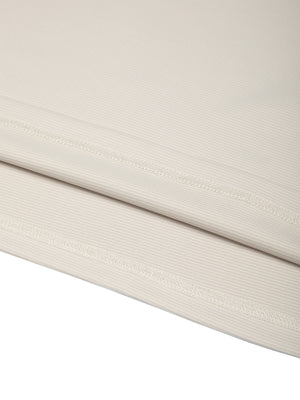 Close-up of the light gray polyester and spandex fabric of the color block t-shirt, fine rib texture