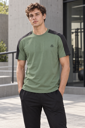 Bean Green with Dark Gray color block athletic t-shirt worn front view, hands in the pockets