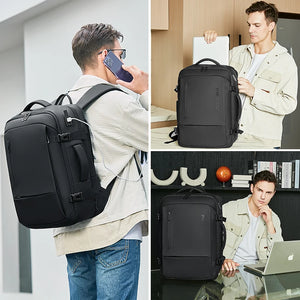 Black nylon commuter backpack with a padded back panel and a top grab handle