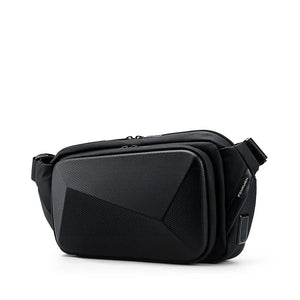 Small black chest bag with angular panels and a single zip