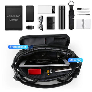Small black chest bag with angular panels and a single zip