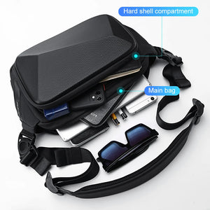 Small black chest bag with angular panels and a single zip