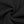 Swirl of the black fleece fabric used for the baggy sweatpants, showing its thick and soft surface