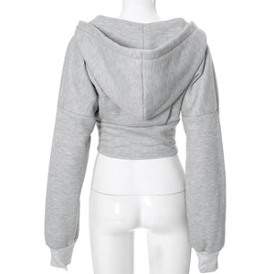 Back of the grey corset hoodie on a mannequin, large hood, dropped shoulders and ribbed cuffs