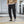Cropped Cargo Cyberpunk Pants in black worn with high-top sneakers, front view, big flap cargo pockets