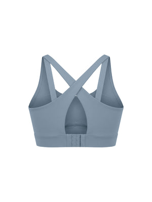 Gray blue yoga bra from the back, the keyhole cut between the straps above the hook-and-eye band