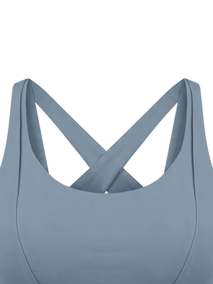 Close-up of the gray blue front, the back straps crossing behind the scoop neck as seen from the front