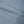 Close-up of a curved front seam, stitched flat into the smooth gray blue knit