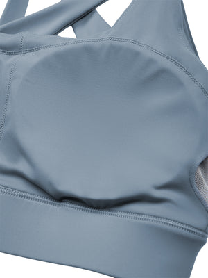 Inside the gray blue yoga bra, a cup pad set into the lining above the elastic band