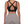Back view on the model, wide black straps crossing in an X over a keyhole and a hook-and-eye band