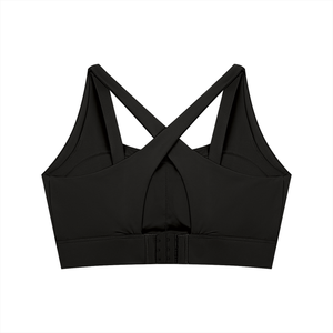 Back of the black yoga bra laid flat, the X straps over the keyhole and the hook fastening below