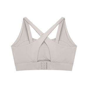 Back of the light gray yoga bra, the crossed straps framing the teardrop opening and the hooks