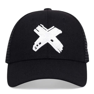 Black trucker cap with a red cross patch and mesh back