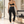 Cyber High Waisted Yoga Leggings in black on a woman in a pilates studio, seen from behind