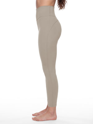 Side view on the model in khaki, the seam running down the leg from hip to ankle