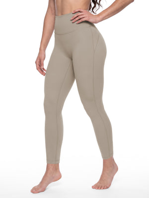 Model in khaki with a hand on her hip, three-quarter back view of the contour seams