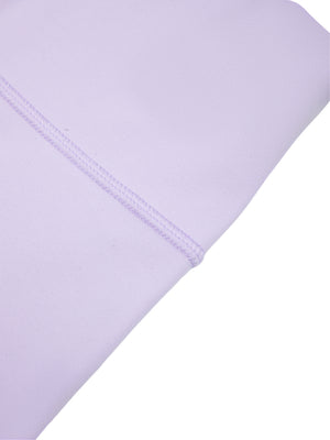 Close-up of a purple leg seam, flat stitching running down the smooth thin knit