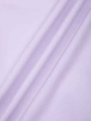 Close-up of the purple nylon and spandex knit, smooth with a soft sheen along a fold