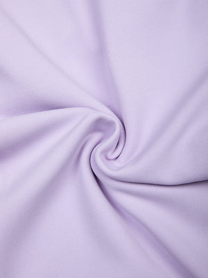 The purple fabric twisted to show its stretch, a thin 215 gsm nylon and spandex knit